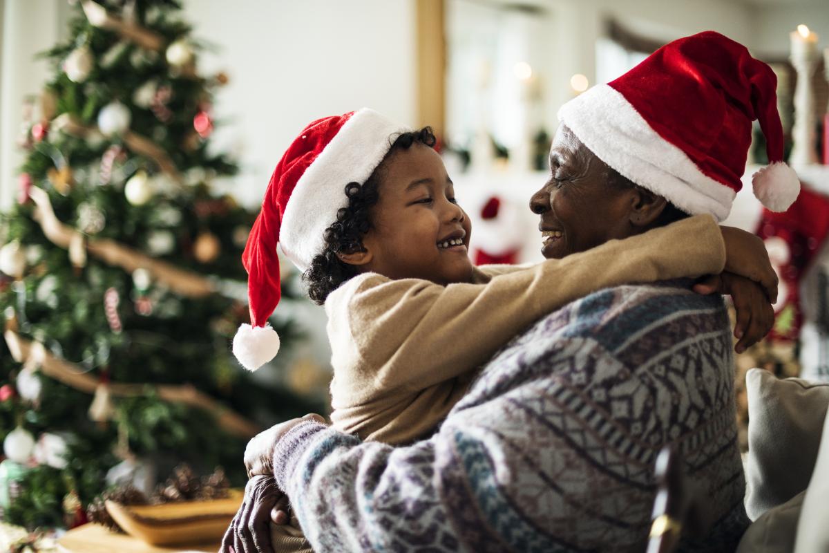 child hugging adult at christmas thanks to addiction recovery