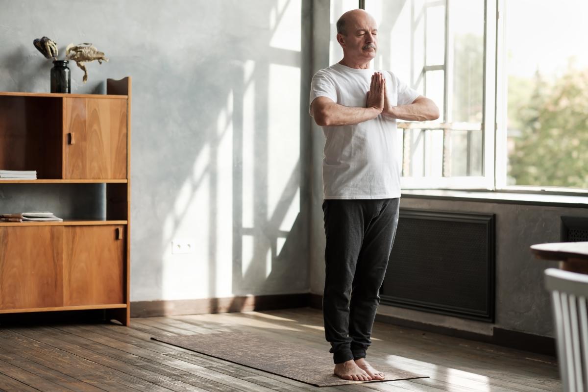 a man does yoga as he wonders how to practice self-care in addiction recovery